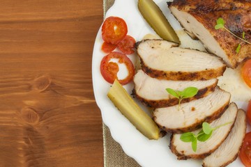Chicken steak with vegetables. Grilled chicken breasts. Dietary meat on the grill. Chicken fried steak. 
