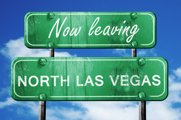 Leaving north las vegas, green vintage road sign with rough lett © Argus