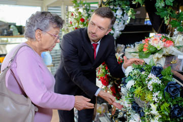elderly woman choosing a bouquet