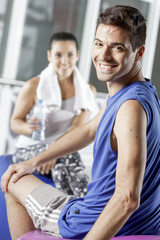 young man exercising with woman trainer
