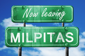 Leaving milpitas, green vintage road sign with rough lettering