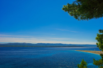 Beautiful seascape on Adriatic bay with yachts and Zlatni rat beach