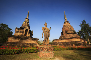 Fototapeta premium Buddha and pagodas Sukhothai Historical Park. Sukhothai, Thailand.