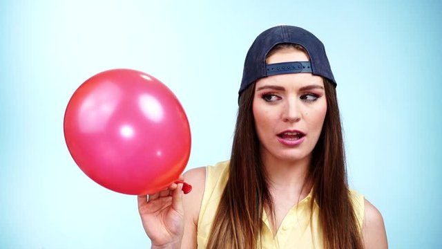 Woman casual style playing with red balloon 4K