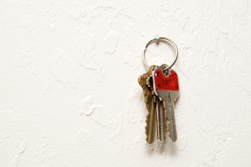 three different keys on wall.