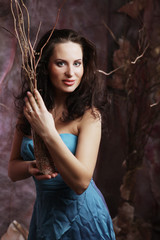 Obraz na płótnie Canvas young woman in blue dress