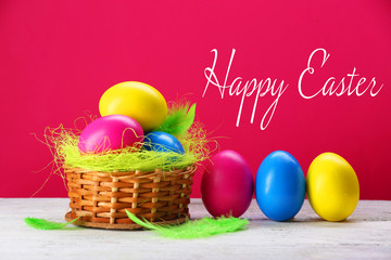 Easter greeting card. Colorful eggs on pink background