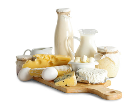 Set of fresh dairy products on wooden board,  isolated on white
