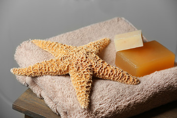 Bathroom set with towel, soaps and starfish