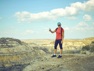  girl  on top of  mountain.