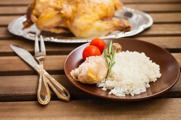 rice with chicken in a plate on a table, selective focus