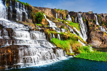 Natural cascades of waterfall with crystal water at summer