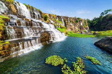 Beautiful view of natural cascading waterfall with clear water