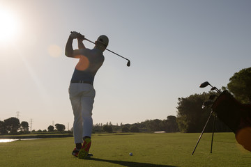 golf player hitting shot