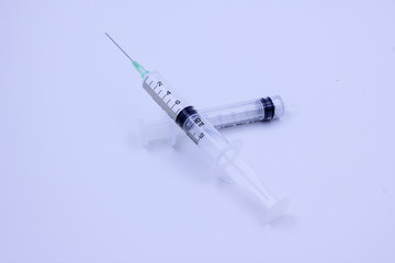 Disposable syringe on white background