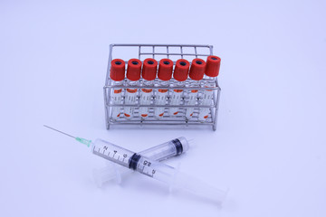 Medicine vials and syringe.