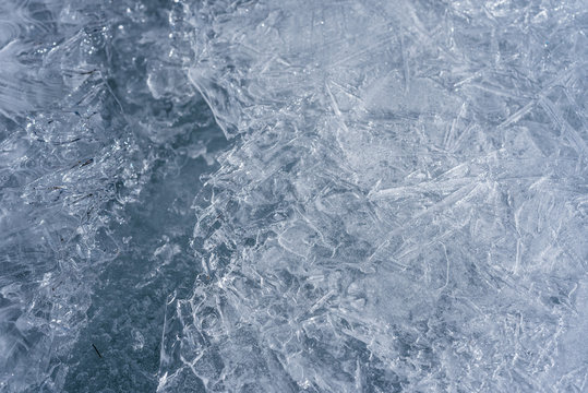 The ice cracked on a lake.