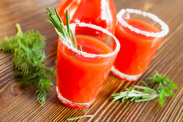 tomato juice in glasses on a table, selective focus