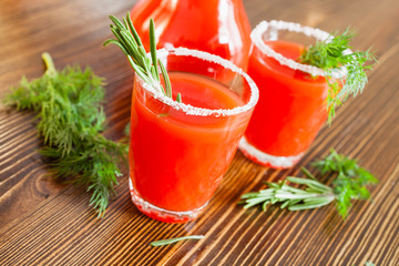 tomato juice in glasses on a table, selective focus