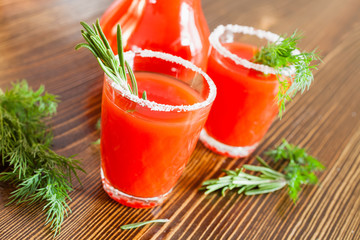 tomato juice in glasses on a table, selective focus