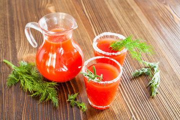 tomato juice in glasses on a table, selective focus