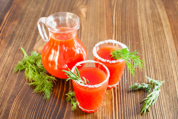 tomato juice in glasses on a table, selective focus