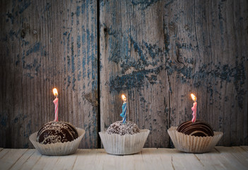 birthday cupcakes on wooden background