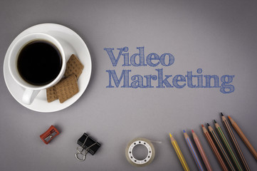 Gray office desk with the inscription - Video Marketing