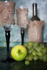 wine bottle green grape on background