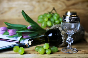 wine bottle book and glass grape