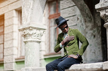 Fashion portrait of black african american man on green velvet j