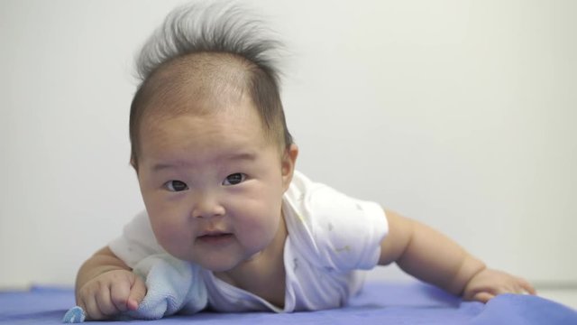 Asian chinese baby smiling happy on a white background