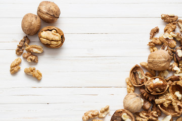walnuts on white wooden background