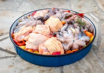 Preparing and Cooking of octopus and chicken in traditional Balk