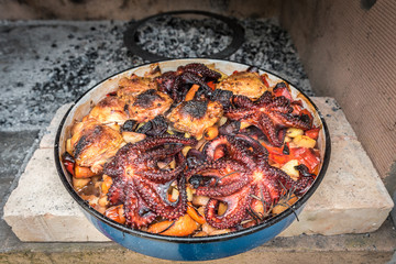 Preparing and Cooking of octopus and chicken in traditional Balk