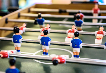 Close up of foosball Table Soccer Game match figures.