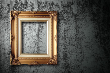 old golden frame on cement wall grunge background