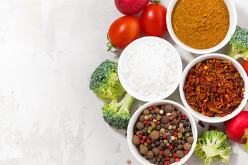 assortment of pepper, salt, spices and fresh vegetables