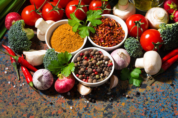 assortment of spices and fresh organic vegetables 