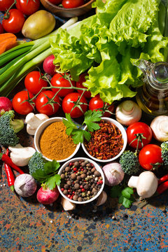 assortment of spices and fresh organic vegetables 