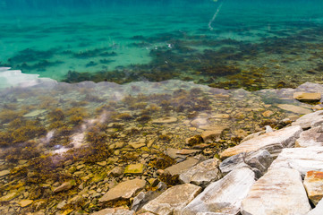 Stony shore and transparent water