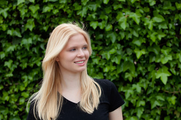 Happy blonde girl outside