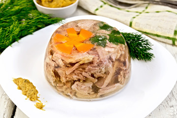 Jellied in plate with mustard on board