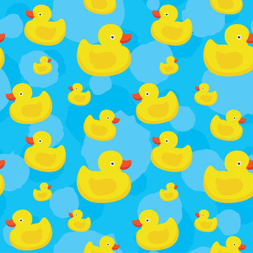 Cute yellow ducks seamless vector pattern on blue background