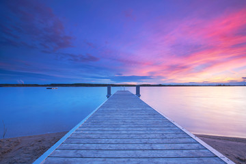 Obraz na płótnie Canvas Urlaub am See, Badesteg zum Sonnenuntergang