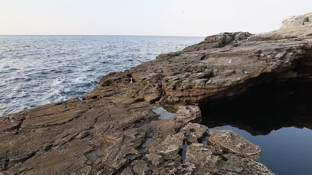 Sea water and rocks in Thassos island, Greece, next to the natural pool called Giola. Sound of waves and wind