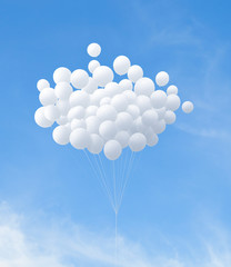 group of white balloons flying in the sky