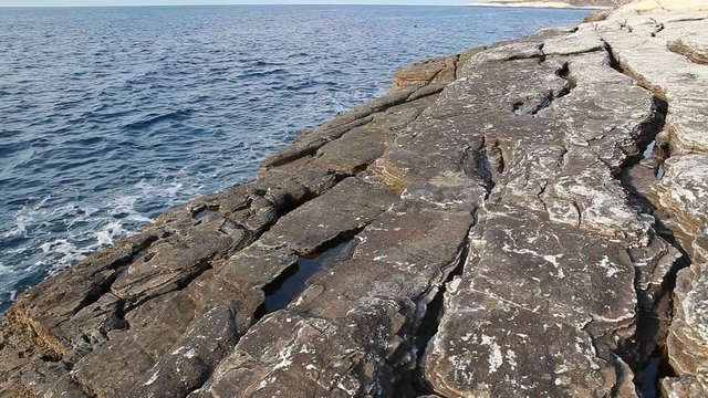 Sea water and rocks in Thassos island, Greece, next to the natural pool called Giola. Sound of waves and wind