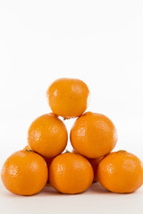 Bright Orange Clementines on a bright background