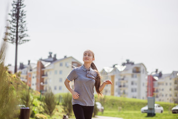 Photo of young blonde woman doing running activities